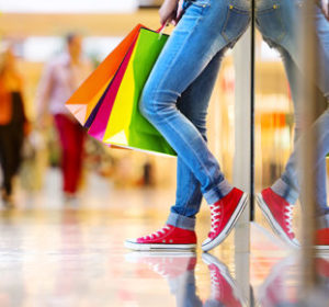 Girl with colored shopping bags - Retail & Hospitality Law